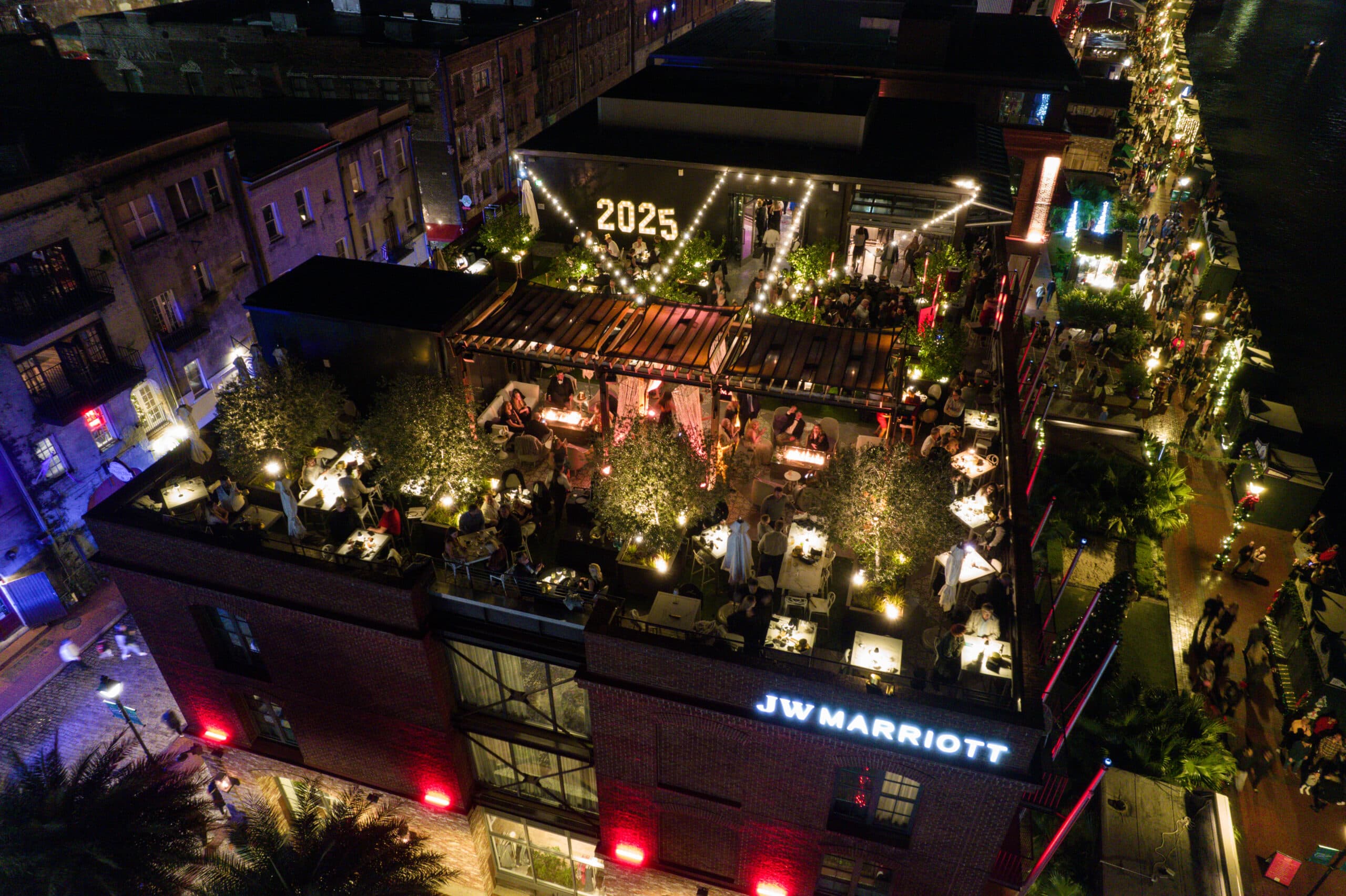 Drone shot of Myrtle and Rose Rooftop bar along the Savannah River